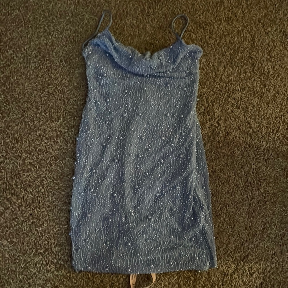 Brand new oh Polly dress, it’s a size 6 in us sizing.